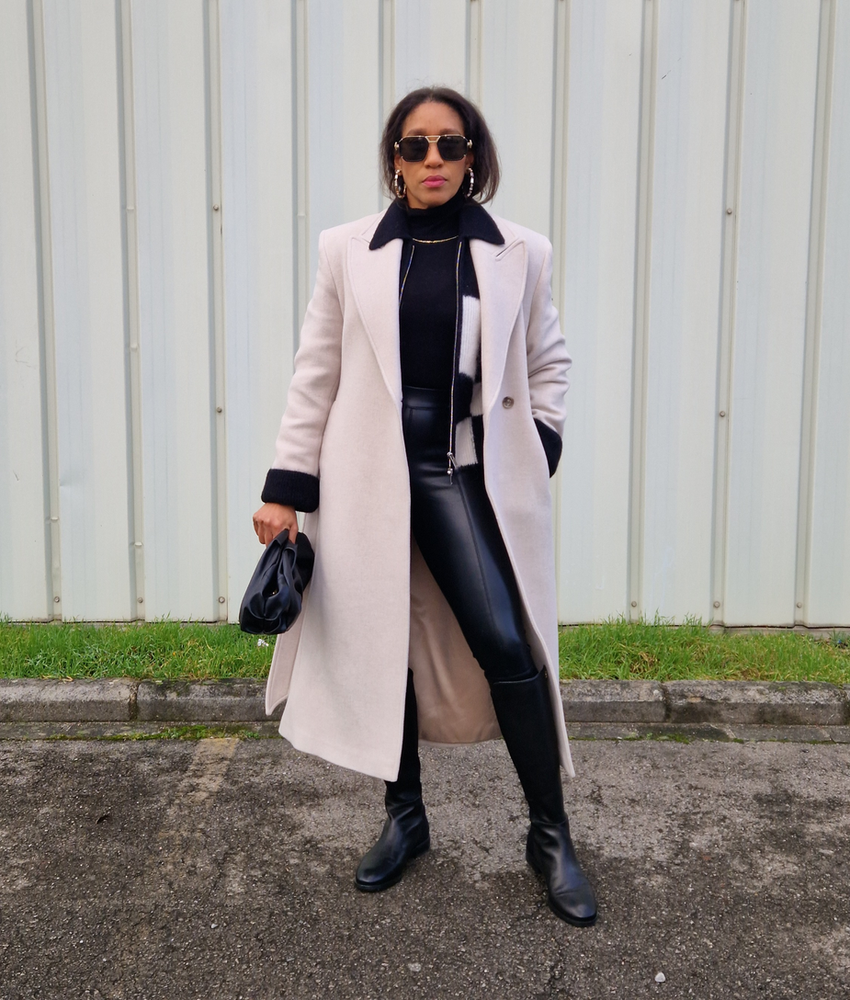 Me with my Winter outfit idea of the day, this outfit is part of my capsule wardrobe for winter 2023 - long wool coat and cardigan are from & other stories, the turtleneck is a merino wool, faux leather leggings from asos, knee-high boots from Stuart Weitzman, Versace sunglasses, my necklace is from AnaLuisaNY, and my clutch bag is from Calvin Klein.