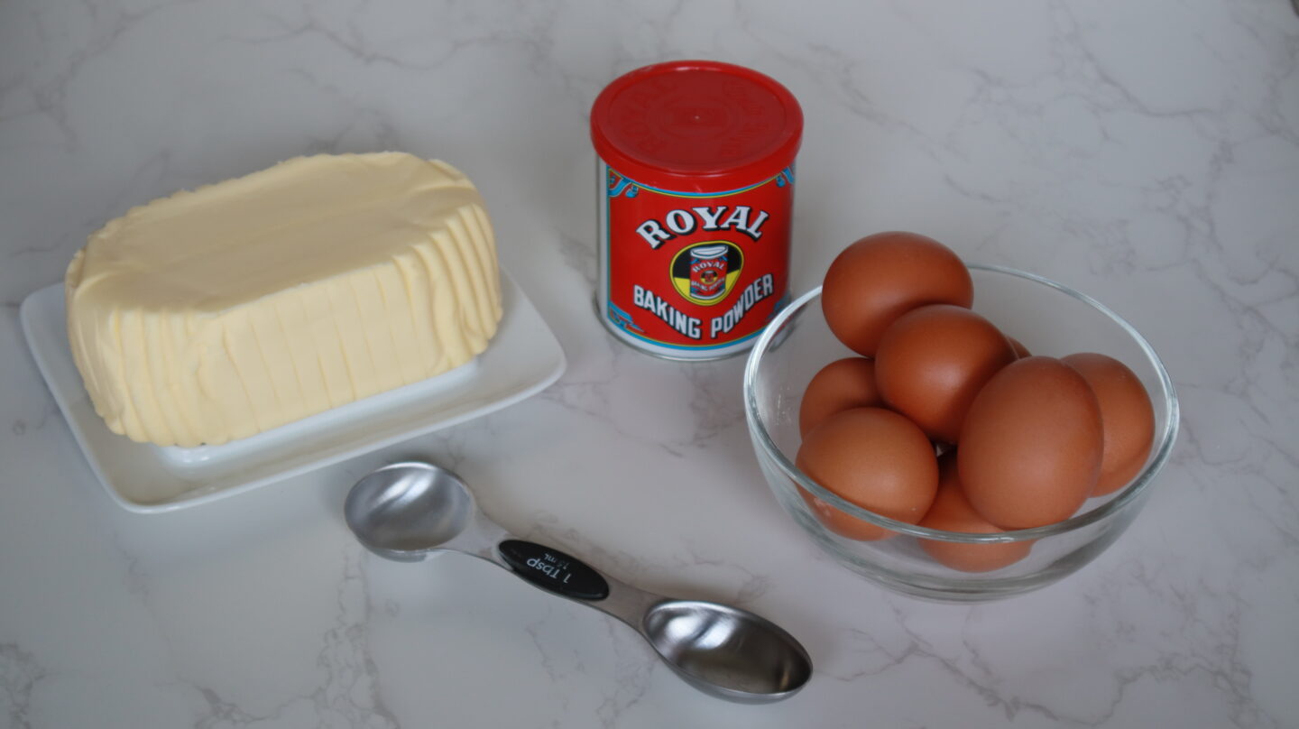 Corn Cake recipe main ingredients which are: butter, corn, eggs, baking powder